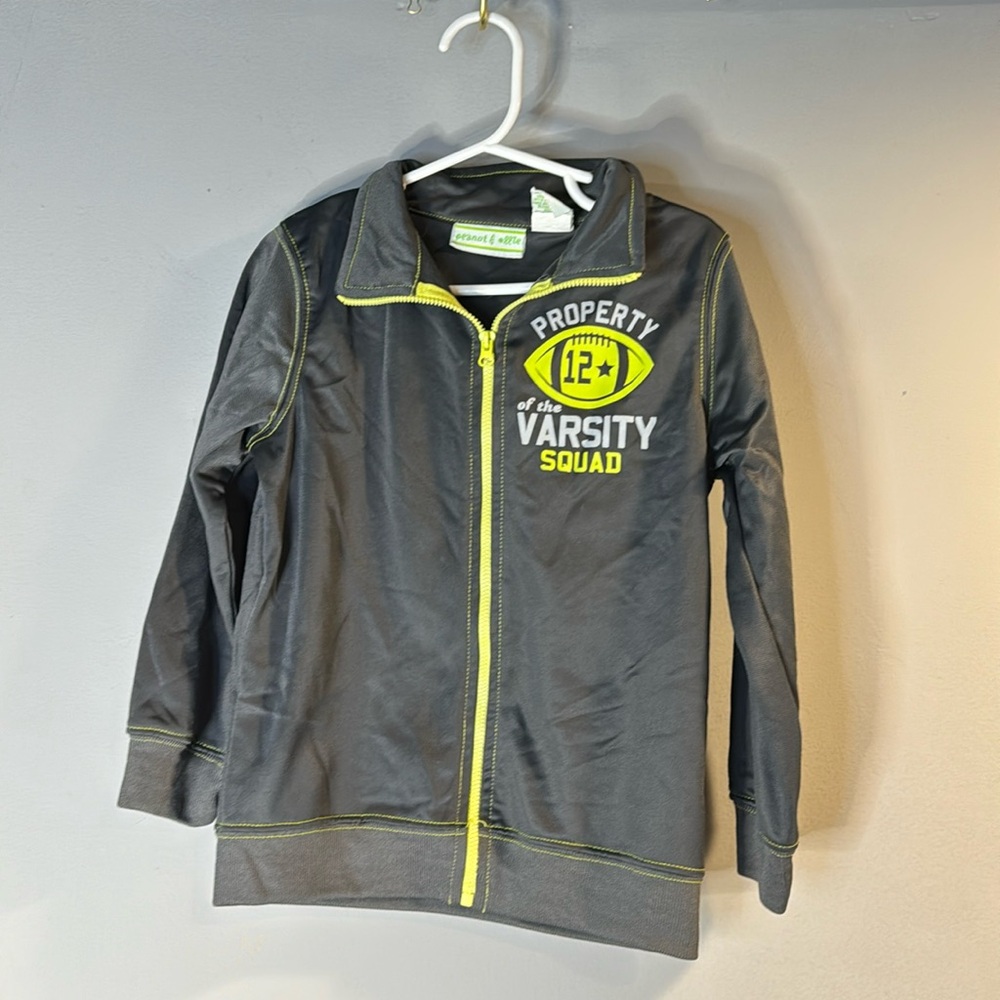 Zip up thin jacket-property of the varsity squad.